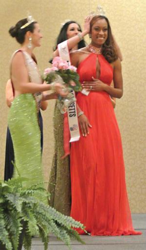 There she is:: Dorchester’s Janelle Woods-McNish, right, was crowned Mrs. Massachusetts during a pageant on March 19 at the Boston Marriott-Newton. Photo courtesy Mrs. Massachusetts